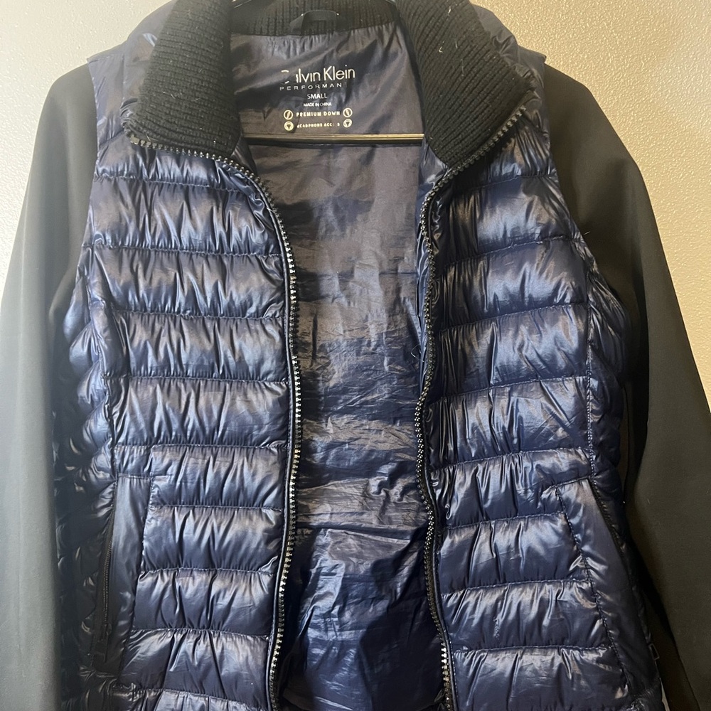 Used Good condition Clavin Klein jacket zipper is missing two teeth